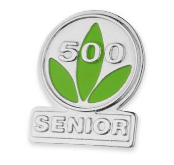 Custom enamel badge with green illustration for an International dietary solutions company